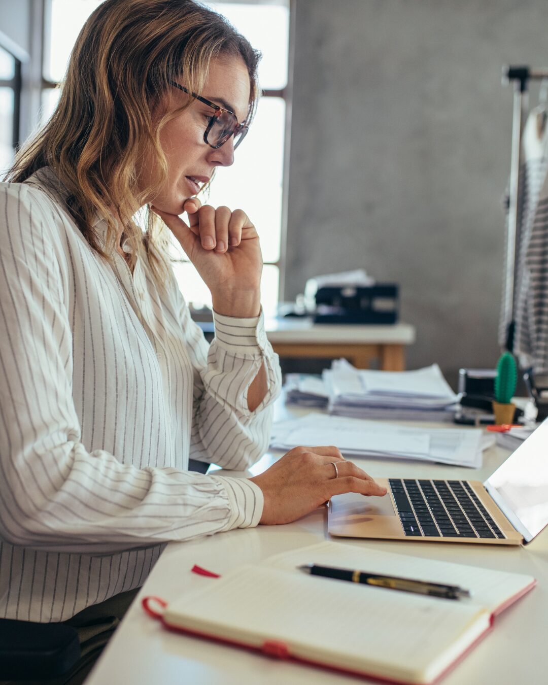Service business owner reviewing social media content tied to priority services and revenue goals