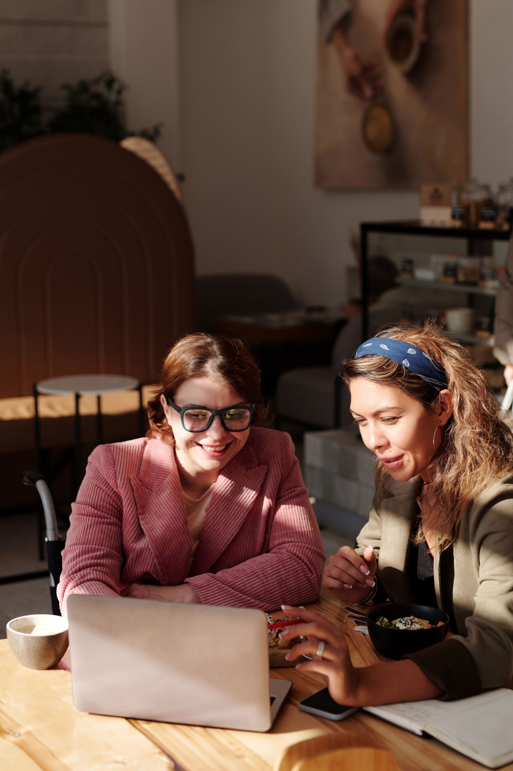 Consultant in a relaxed meeting with a long-term client, showing a reputation built through personal relationships